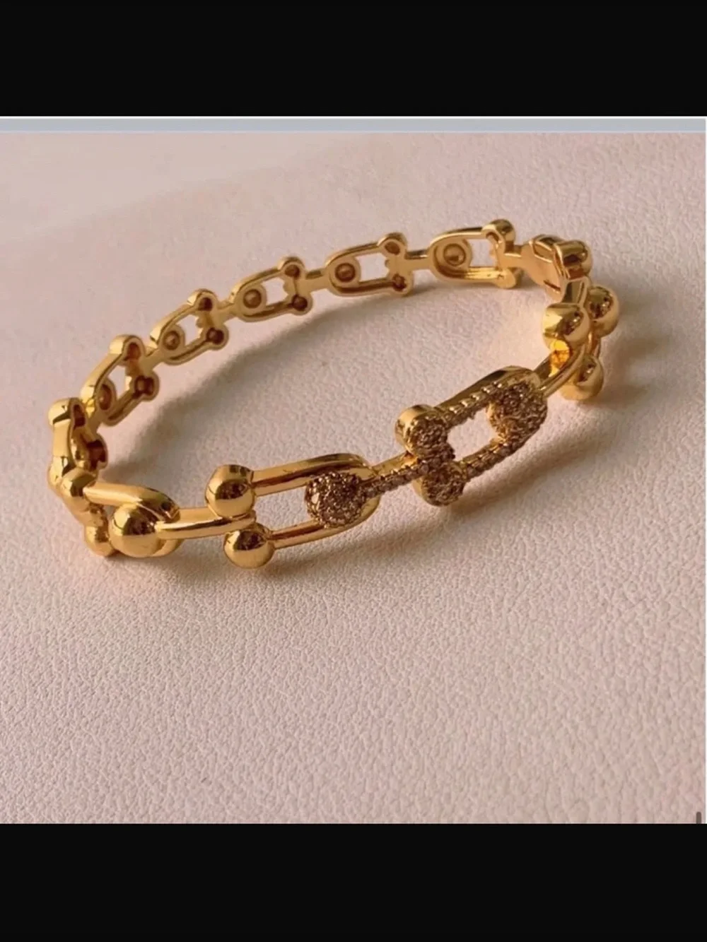 Goldtone bracelet.
